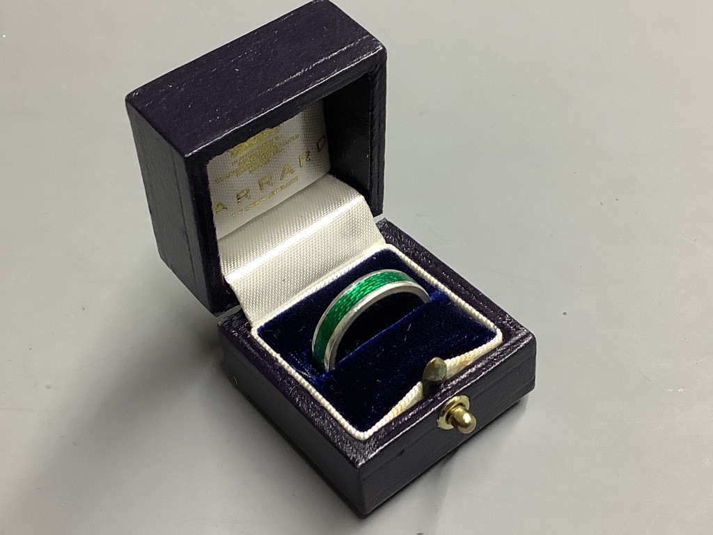 A Garrard's modern silver and green enamel band,